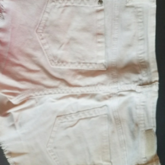Wow them in these trendy white shorts! - Picture 2 of 3